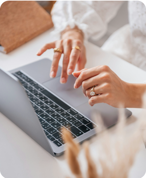 Woman scrolling on laptop